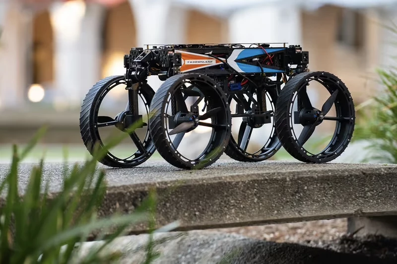 Flying robot morphs mid-air to land and roll on wheels